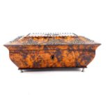 A Regency burr yew wood sarcophagus form casket converted to a musical box, the hinged lid with