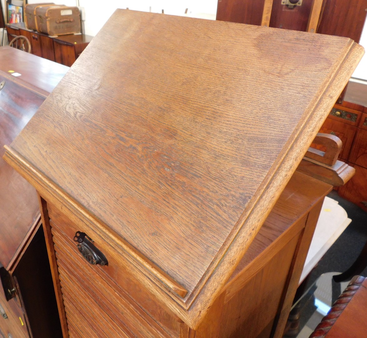 A Victorian oak tambour fronted clerk's desk, with a hinged lectern top, over nine sliding trays, - Image 3 of 4