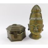 An Indian brass pandan box, 12cm diameter, together with a brass wall mounted bust of a Hindu deity,