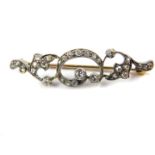 A Victorian diamond foliate scroll brooch, set in white and yellow metal, 3.3g.