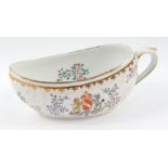 A Sampson late 19thC porcelain bourdaloue, decorated in the Chinese Export style, with a coat of