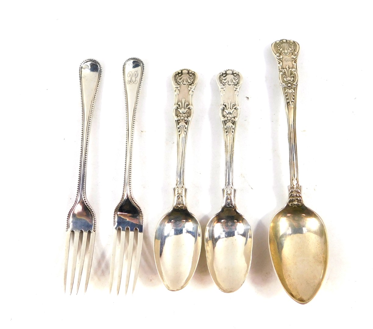 A Victorian silver Kings pattern dessert spoon, monogram engraved, the reverse of the bowl with