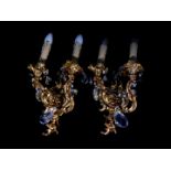 A pair of Italian brass baroque style twin branch wall lights, with cut glass drops, 43cm high.