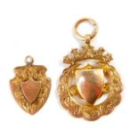 Two 9ct gold shield medallions, 8.0g.