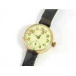 A 1930's 9ct gold wristwatch, circular cased, cream dial bearing Arabic numerals, subsidiary seconds