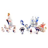 A Russian porcelain liqueur set, of standing fish form, comprising a decanter and stopper and six