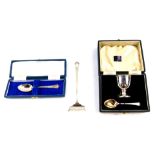 A George VI silver child's egg cup and spoon, boxed, London 1950., a commemorative teaspoon,