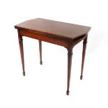 An Edwardian Sheraton Revival card table, with shaped rectangular fold over top with cross