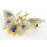 A diamond ruby and sapphire butterfly brooch, set in white and yellow metal, 4.6g.