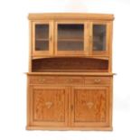 A Victorian stripped pitch and plain pine dresser, with beaded and glazed upper section, three