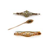A Victorian 9ct gold bar brooch, a 9ct gold and seed pearl brooch, and a demantoid garnet and seed
