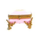 A Paris late 19thC porcelain miniature casket, with foiled brass mounts, reserve painted to the