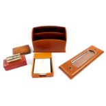 An Asprey of London tan leather three piece desk set, gilt tooled, comprising two tier stationery