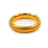 A 22ct gold wedding band, size K, 6.8g.