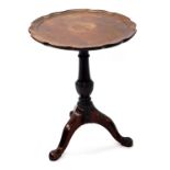 A Georgian mahogany tripod table, with circular moulded piecrust tilt top, baluster stem and three
