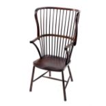 A Victorian stained beech wing high back Windsor chair, by Druce & Co, London, with crook arms,