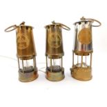 A Protector Lamp and Lighting Company Ltd Type 6 miner's safety lamp, Approval No B/28, and two