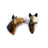 A pair of late 20thC pottery horse's head wall plaques, 14cm high.