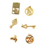 Six 9ct gold charms, including two keys, a horse's head and a St Christopher, 9.6g.