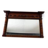 A Victorian mahogany overmantel mirror, with turned columns, enclosing a reeded slip rectangular
