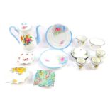 A group of Shelley porcelain, including a coffee pot, part coffee service, three tea plates, and