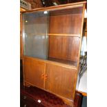 A stained mahogany bookcase, with two sliding glass doors and lower cupboard, 122cm high, 92cm wide,