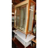 A 1960's glazed and gilt decorated china cabinet, 107cm high, 75cm wide, 30cm deep, together with