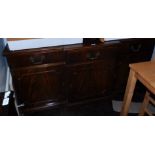 A reproduction mahogany break front sideboard, with three drawers above three cupboard doors, 80cm