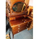 An Edwardian mahogany dressing chest, with oval swing frame mirror above two over two drawers, 150cm