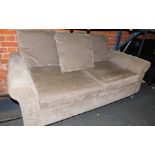A grey two seater sofa bed.