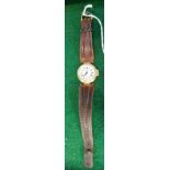 A Dunhill lady's stainless steel and gold plated wristwatch, circular white dial bearing Roman