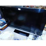 A Panasonic 32" colour television, model no TX-32LXD85, with remote and instructions.