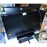 A Sharp 22" colour television, model LC-22D12E, with remote, together with an Acer computer monitor.