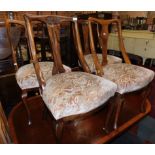 A Harlequin set of four early 20thC walnut dining chairs, raised on cabriole legs. (2 pairs)