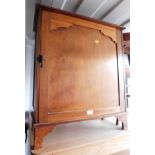 A 20thC mahogany cupboard, opening to reveal a single shelf, 75cm high, 65cm wide, 33cm deep.