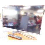 A Samsung 32" colour television, model UE32J5600AKXXU, with remote.