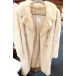 A Calman Links white mink fur coat.