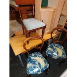 Two Victorian walnut balloon back chairs, together with a mahogany dining chair. (3)