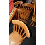 A Harlequin set of six beech kitchen chairs, with lath backs and turned legs.