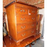 A television cabinet in the style of a Georgian chest of drawers, 88cm high, 78cm wide, 48cm deep,