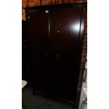 A Stag Minstrel two door wardrobe, 177cm high, 96cm wide, 61cm deep.