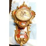 A CM floral decorated plastic wall clock, 53cm high, together with a wooden cased mantel clock