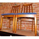 A pair of late 20thC beech framed dining chairs, with blue seats. The upholstery in this lot does