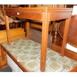 A teak games table, stamped verso AC (Military mark) 1975, raised on square legs, 71cm high, 92cm