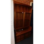 A Nathan teak glazed display cabinet, with upper shelf above two glazed doors and two panelled