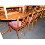 A reproduction mahogany pedestal extending dining table, with one leaf, 75cm high, 183cm wide, 229cm