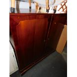 A large reproduction mahogany television cabinet, with lower compartment, 123cm high, 125cm wide,