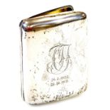 An Edwardian silver cigarette case, of inverted shaped form with initials dated 24.2.1902 to 22.10.1