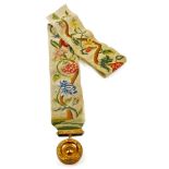 A late 18thC embroidered bell pull, profusely decorated with a petit point entwined floral decoratio