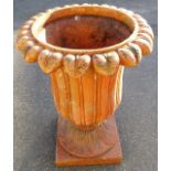 A fire clay classical style urn planter, with floral top on an inverted acanthus stem and plain squa